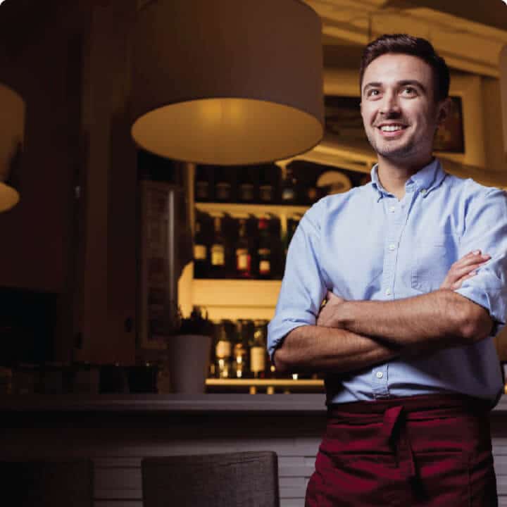 Man smiling in a kitchen