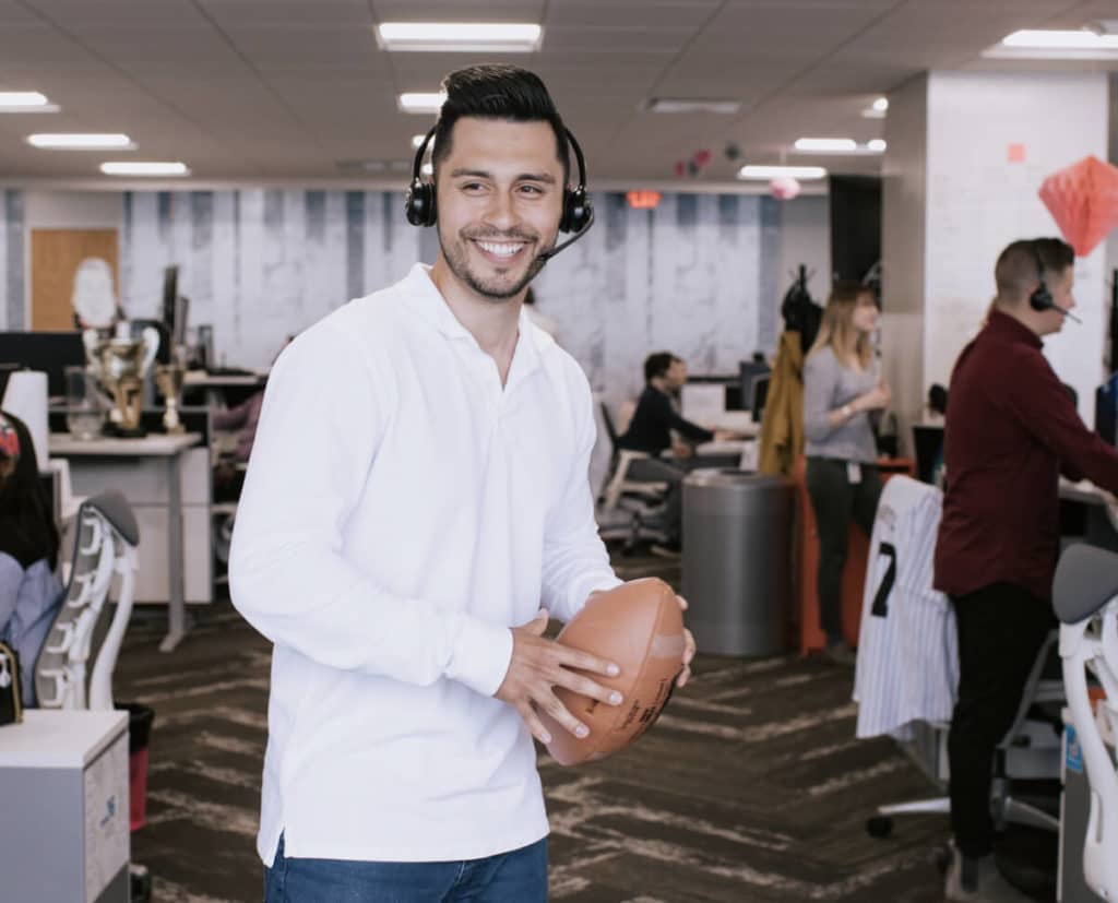 Man in an office with a football
