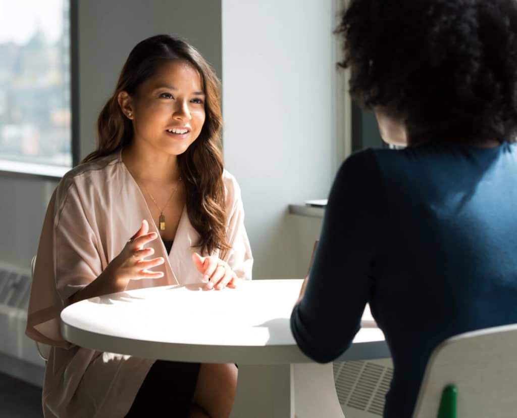 Women talking at a table