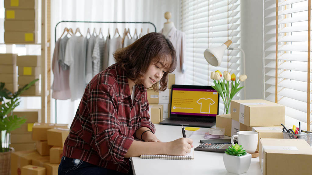 Woman writing in notebook