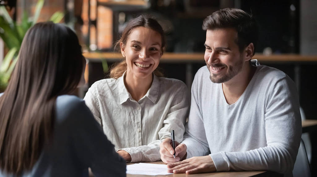 People smiling at a table